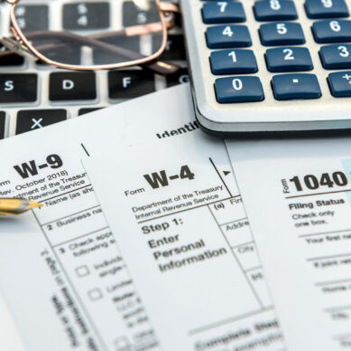 Financial,Time,Tax,Form,With,Laptop,And,Calculator.,Office,Paperwork.